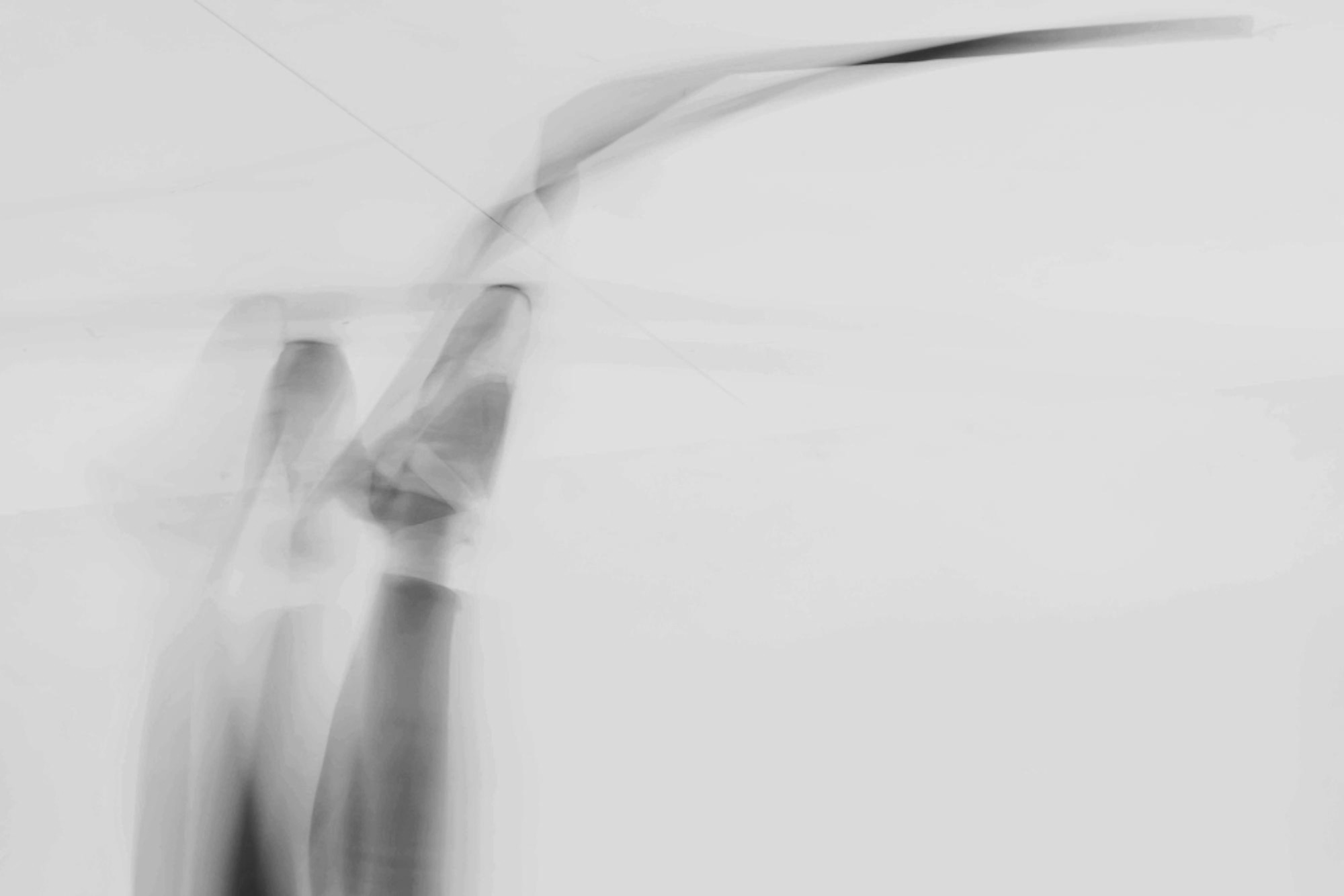 Abstract blurred black and white photograph of dancers on pointe in motion